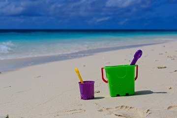 kids toys on tropical sand beach
