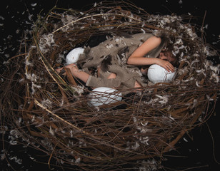 girl the chick in the nest with eggs