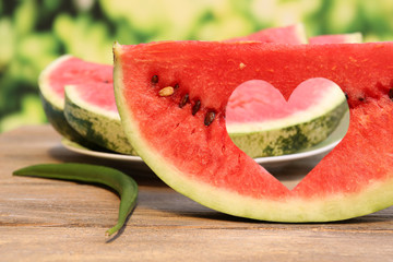 Fresh slice of watermelon on table outdoors, close up