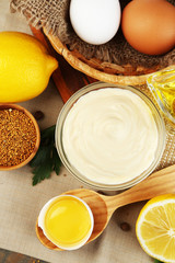 Mayonnaise ingredients on wooden background