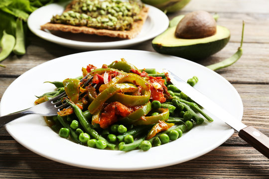 Healthy salad with peas and asparagus served