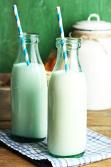 Retro still life with tasty rustic milk, on wooden table