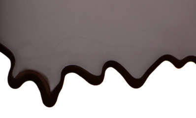 Melted chocolate dripping on white background