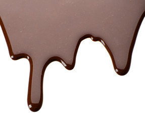 Melted chocolate dripping on white background