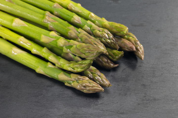 green asparagus on a slate plate