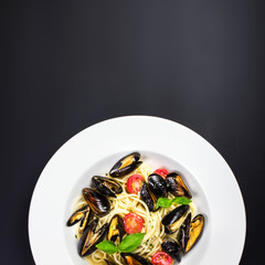 Italian pasta with Mussels marinara, cherry tomatoes and herbs f