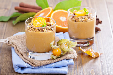 Pumpkin smoothie with granola on top