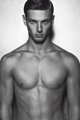 Fototapeta premium Male beauty concept. Portrait of fashionable and undressed young