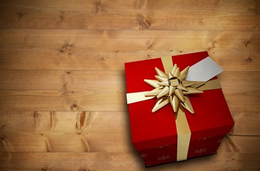 Composite image of christmas present with bow