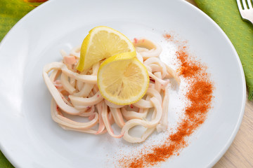 Boiled squid with a lemon