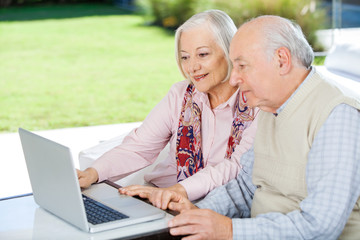 Senior Couple Using Laptop