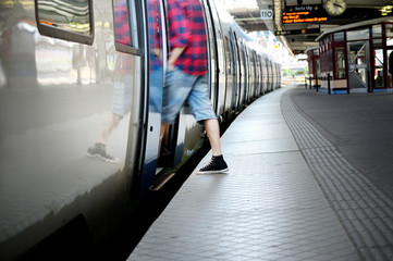Motion blurred man entering train