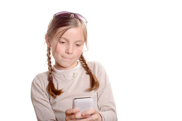 Fototapeta premium a young girl playing with a mobile phone