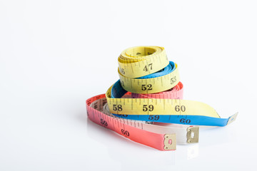 Four colorful  measuring tapes