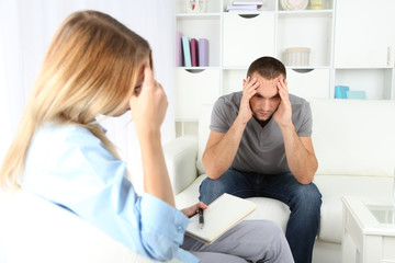 Fototapeta premium Young man on reception at psychologist