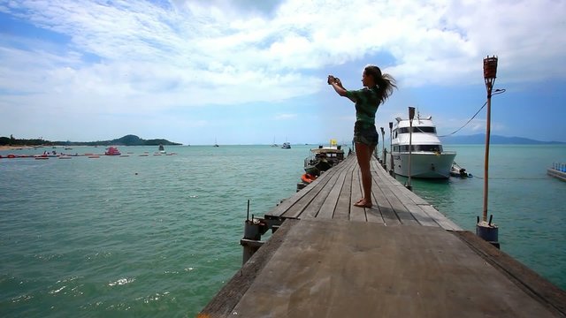 Woman take a picture from bridge of nature on the island Koh