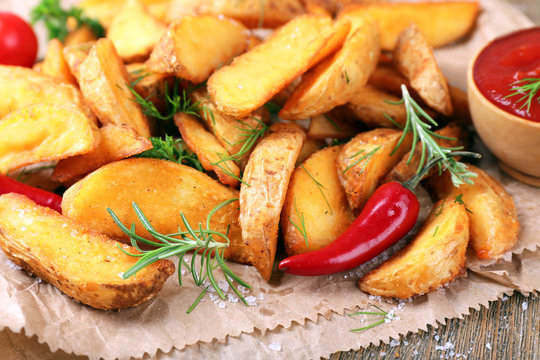 Homemade fried potato with spices and herbs