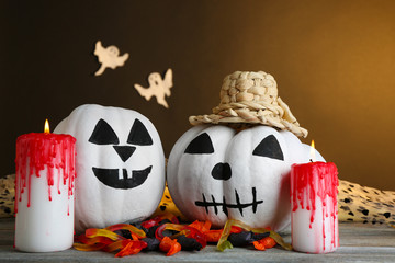 White Halloween pumpkins and candles