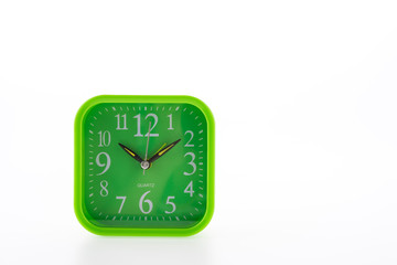 Green clock isolated on white background