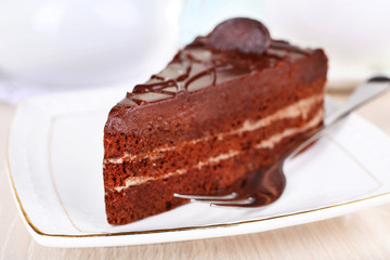 Piece of chocolate cake on plate