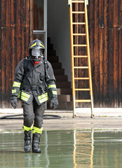 Fireman with the uniform wet after the fire-fighting Services tu