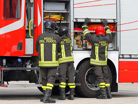 firefighters working near the fire truck when handling an emerge