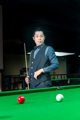 Handsome man playing snooker