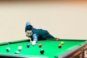 Handsome man playing snooker