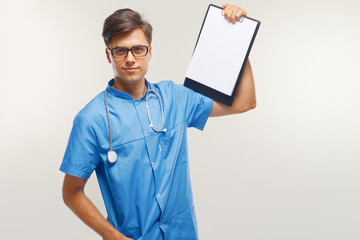 Doctor Showing Clipboard Over White Background