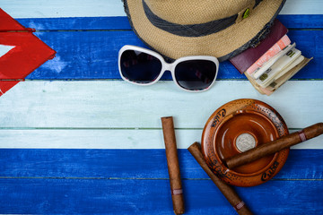 Cuban cigars and ash tray on flag