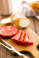 Fototapeta na wymiar sliced chorizo salami on cutting board