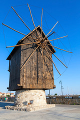 Fototapeta na wymiar Ancient wooden windmill on the sea coast, Nessebar
