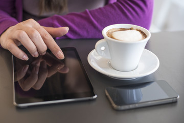 Women Using Phone and Tablet