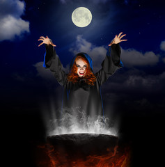 Witch with cauldron on night sky background