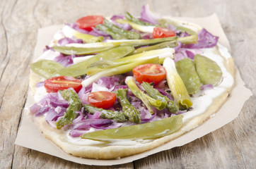 vegetarian tarte flambee on brown paper