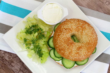 Bagel with cream cheese, cucumber and watercress