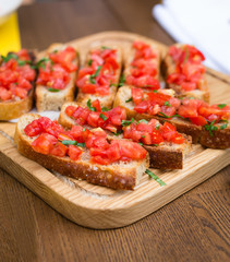 Bruschetta with sweet tomatoes and basil