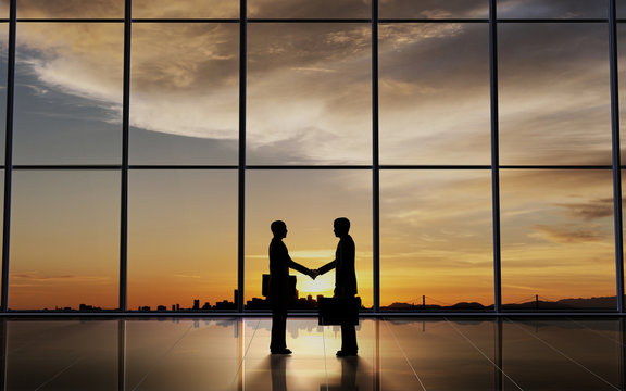 Two Business shake hand silhouettes