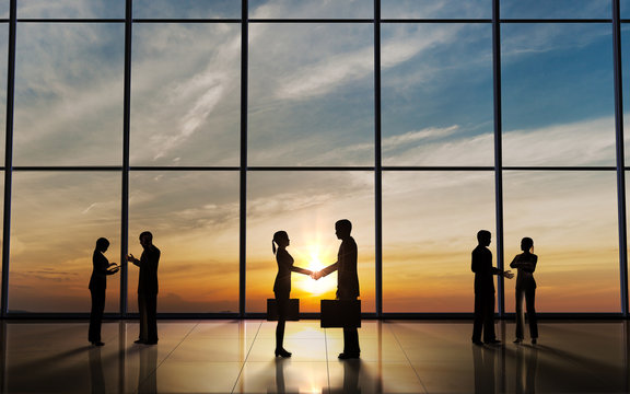 Two Business shake hand silhouettes