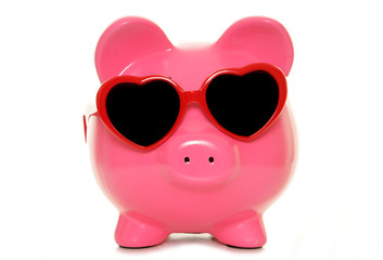 piggy bank wearing heart shape glasses