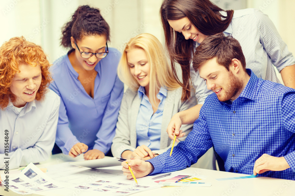 Canvas Prints smiling team with color samples at office