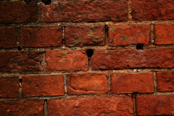 The pattern of the wall from red brick