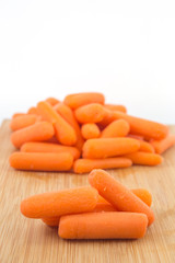 baby carrots on white background