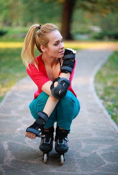 Roller sporty girl in park, woman outdoor fitness activities