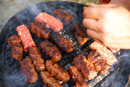 Traditional romanian outdoor grill  meat  food  - "Mici "