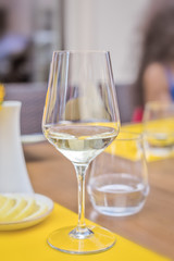Glass of wine in restaurant. Shallow DOF