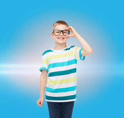 smiling little boy in eyeglasses