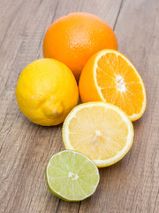 Fototapeta na wymiar Oranges, Lemons And Lime Fruit On Table