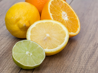 Fototapeta na wymiar Oranges, Lemons And Lime Fruit On Table