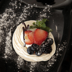 traditional summer dessert pavlova with fresh berries